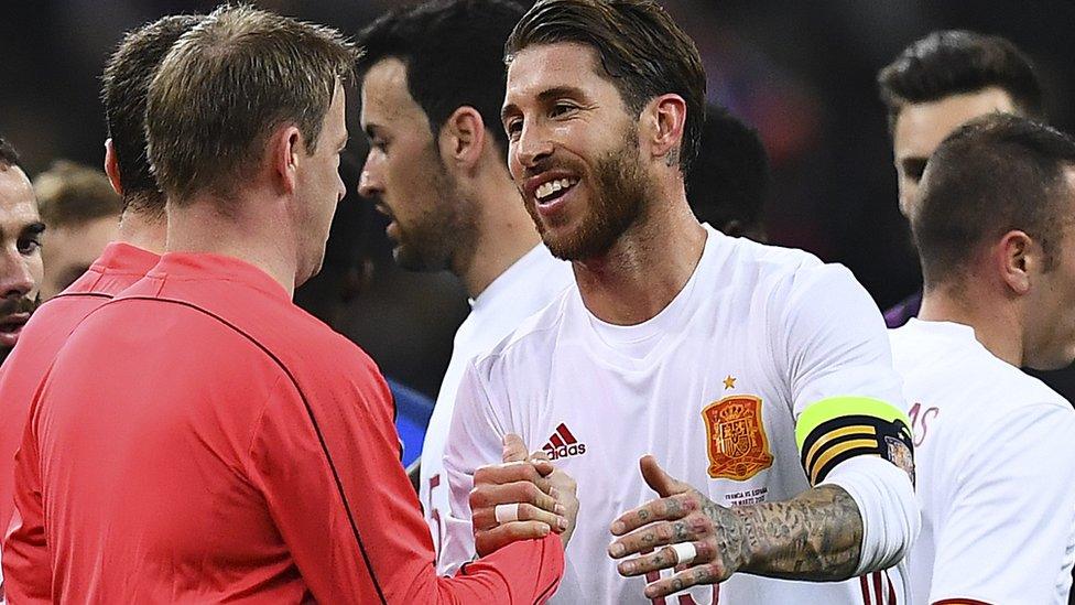 Sergio Ramos shakes hands with a referee at the end of the friendly football match France vs Spain on March 28, 2017