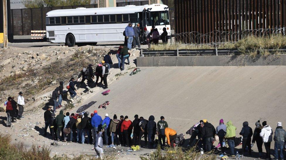 Migrants crossing into El Paso