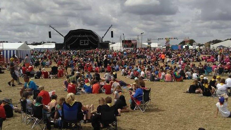 Scouts gathered in front of a stage at Essex International Jamboree