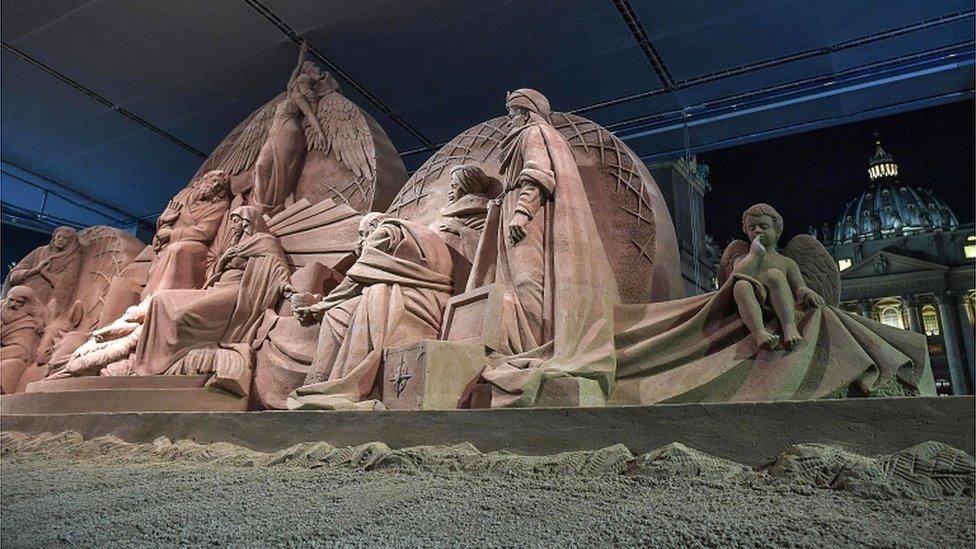 The sand sculpture was unveiled at the same time as the official St Peter's Square Christmas tree lighting ceremony