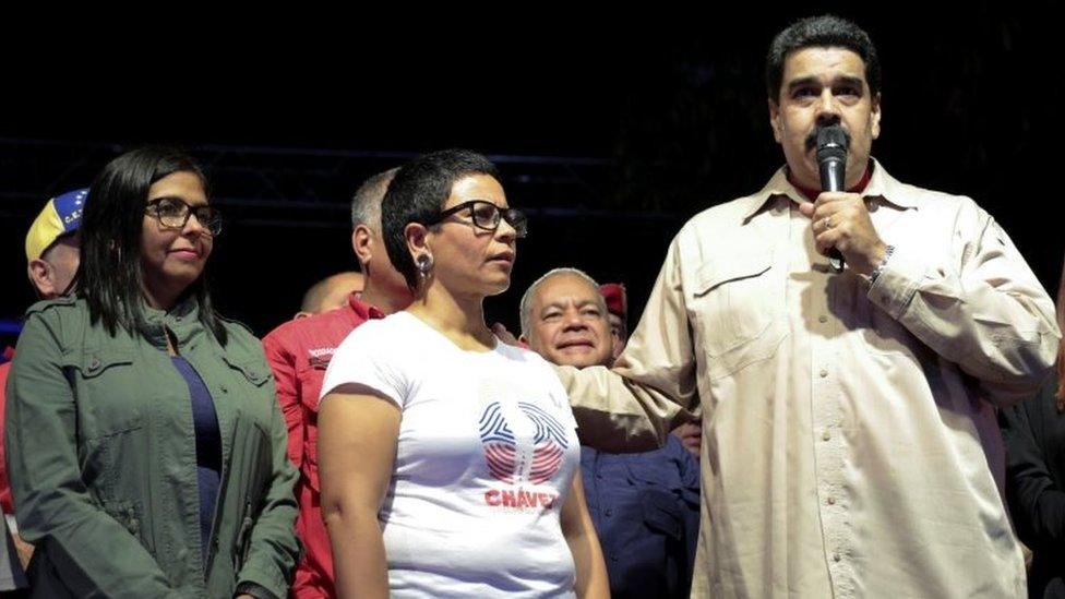 Venezuela's President Nicolas Maduro speaks during an event with supporters, next to newly elected mayor of Libertador district Erika Farias (C) and President of Venezuela's National Constituent Assembly Delcy Rodriguez (L), in Caracas on 10 December 2017