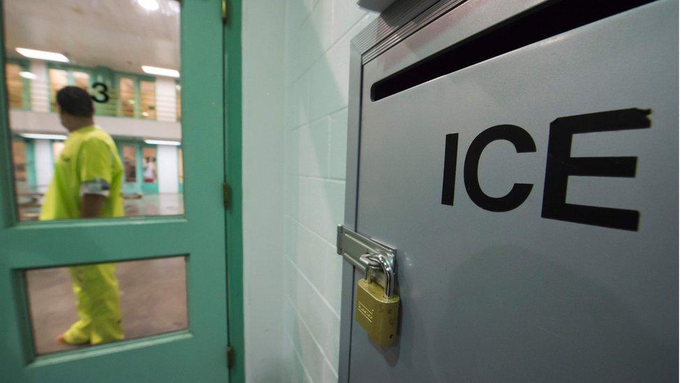 An immigration detainee stands near a US Immigration and Customs Enforcement (ICE) grievance box in the high security unit at the Theo Lacy Facility, 14 March 2017 in Orange, California