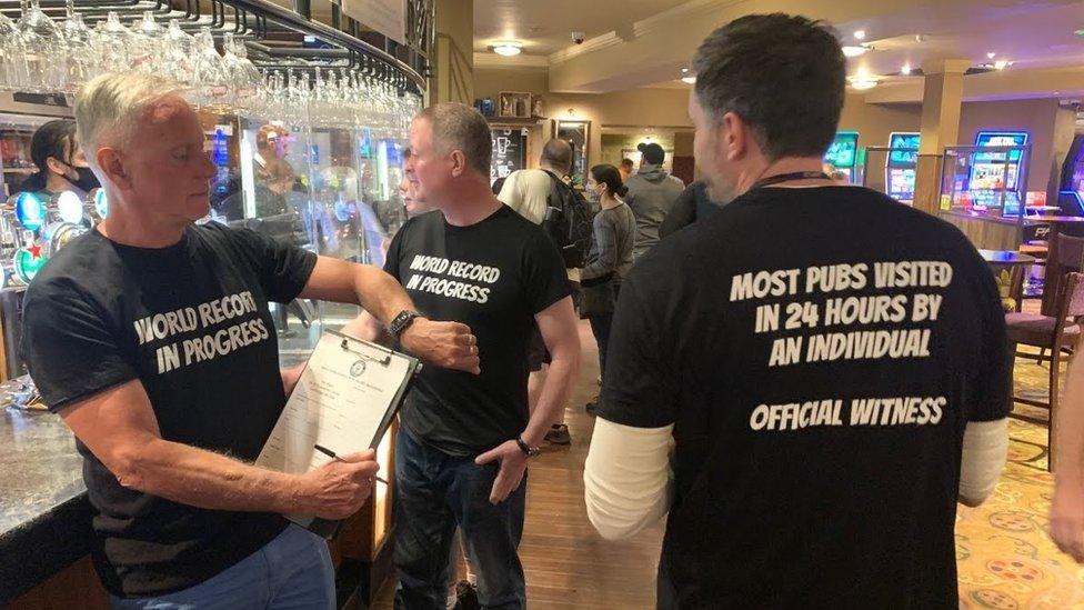 Matt Ellis in a pub with record attempt witnesses