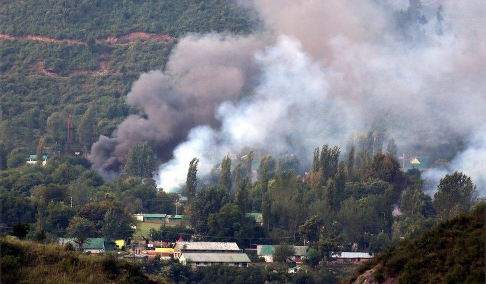 Smoke billows out from inside an Indian Army base which was attacked by suspected militants in Uri, some 115 west of Srinagar, the summer capital of Indian Kashmir, 18 September 2016