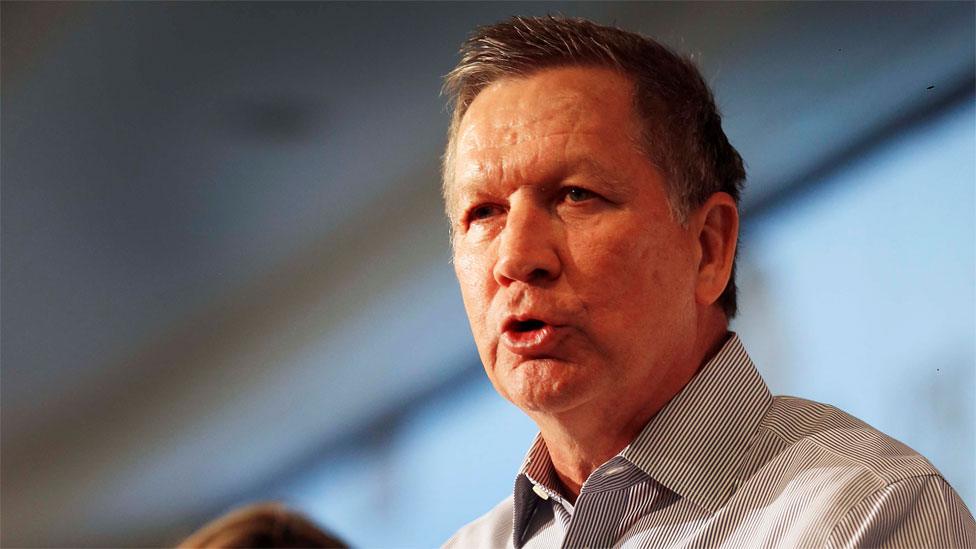 Jessica Nickel listens at left as Republican presidential candidate, Ohio Gov. John Kasich speaks during a stop at an Addiction Policy Forum, Tuesday, Jan. 5, 2016,