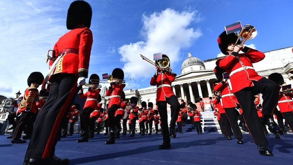 Guardsmen herald the arrival of the athletes during the event