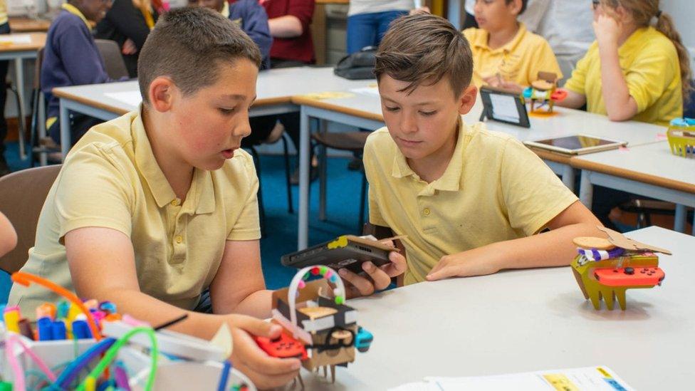 Kids working on Nintendo Labo.