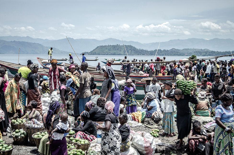 Vendors and shoppers at Kituku market on the shores of Lake Kivu