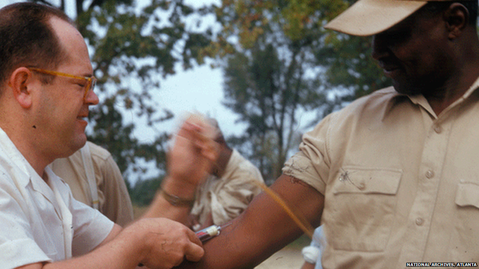 Photo of doctor taking blood during the Tuskegee Study, National Archives, 18892