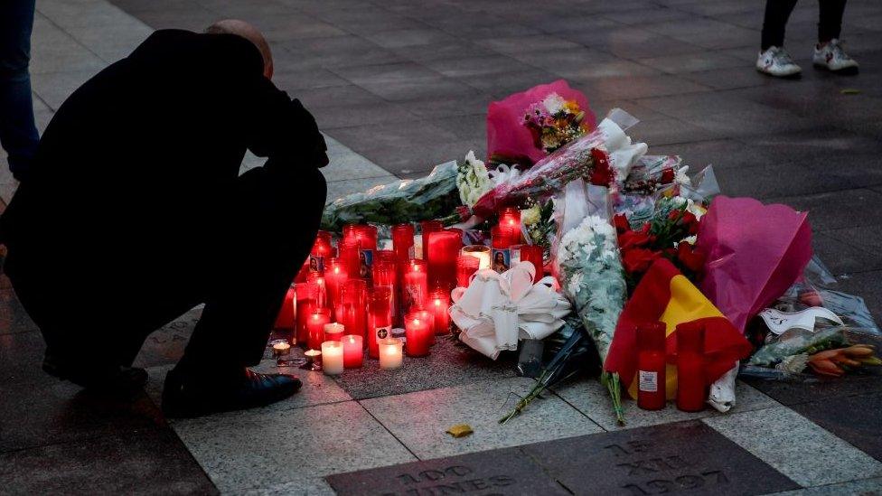 Flowers are laid in Algeciras after a verger is killed