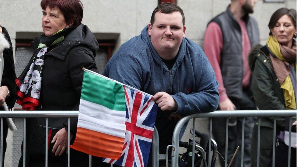 Fans held union and tricolour flags to express support for the couple