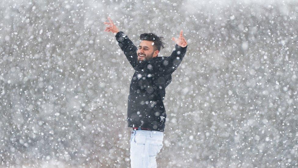 Man in the snow in Dunstable, Bedfordshire