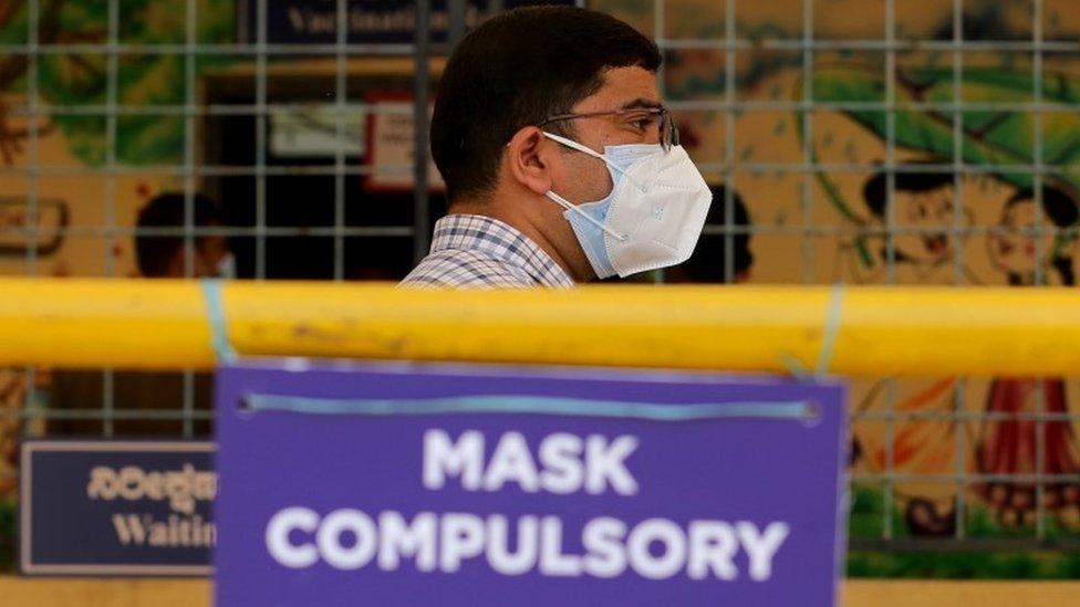 An Indian man waits for COVID-19 vaccine during the vaccination drive in Bangalore, India, 24 May 2021