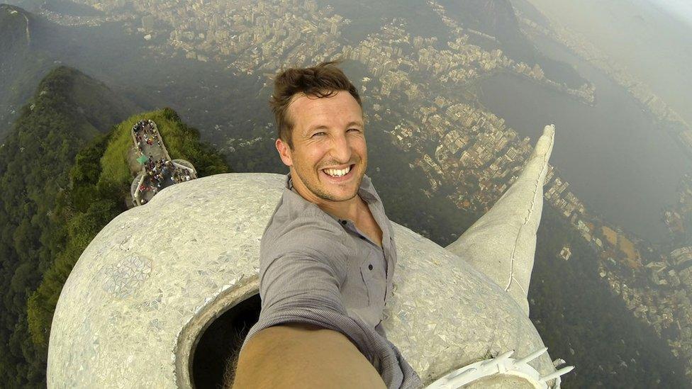 Lee Thompson on top of the Christ the Redeemer statue