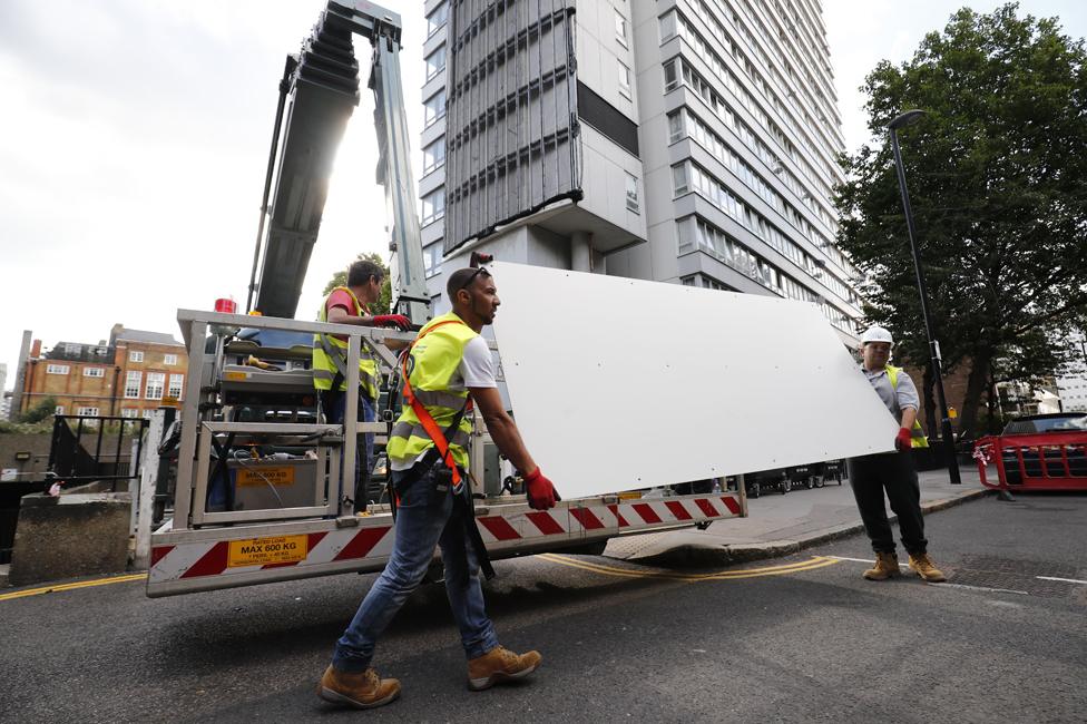 Cladding is removed from Braithwaite House, Islington, in the wake of the Grenfell fire (July 2017)