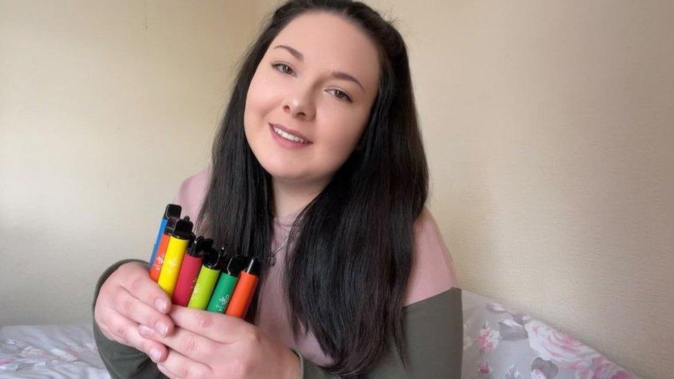 Chloe with her vape pens