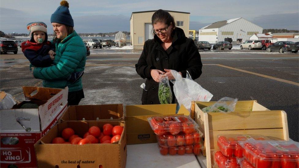 Coast Guard families pick up groceries at a food pantry