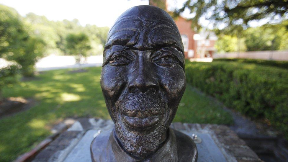 A statue of Cudjoe Lewis, the last surviving person brought over on the slave ship Clotilda