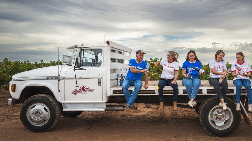 The Ratcliff family seated on a truck