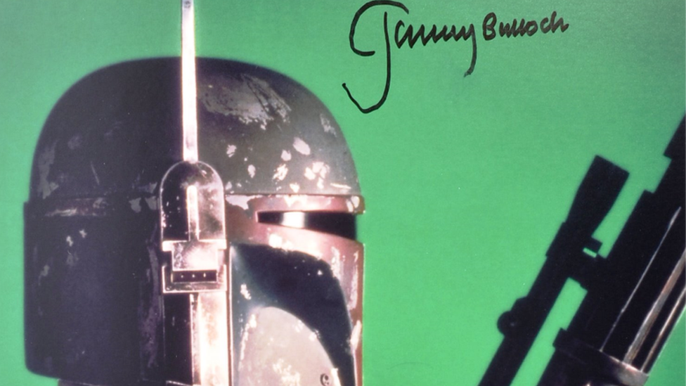 A signed photograph of Boba Fett