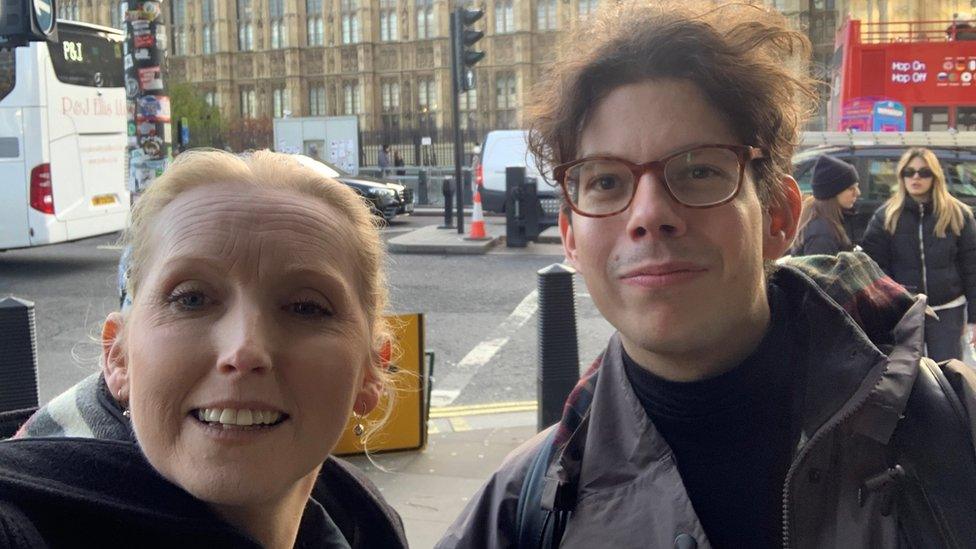 Picture of man and woman outside Houses of Parliament in London