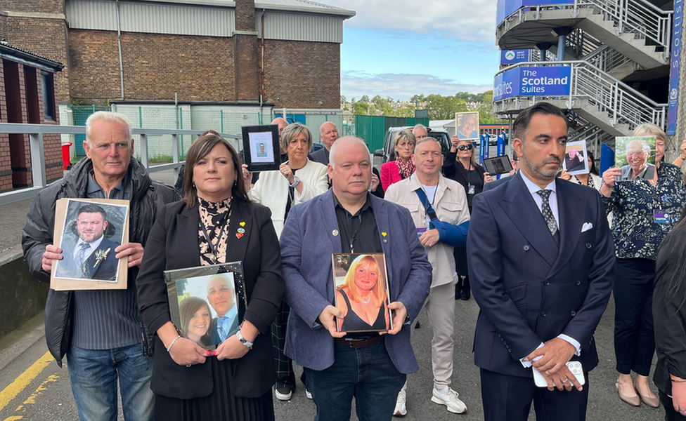 Members of the Scottish branch of the UK group Covid-19 Bereaved Families for Justice and solicitor Aamer Anwar