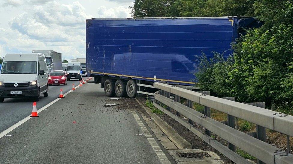 Lorry breaks hard shoulder barrier on M1