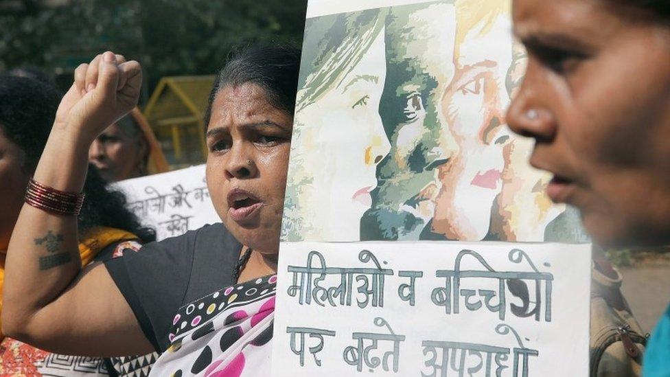 Protesters demand security for women and children following the rape of a 4-year-old girl in Delhi, India, 13 October 2015