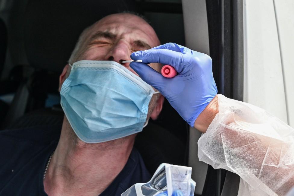 A man is tested for coronavirus after losing the sense of taste and smell, at a drive-in testing centre in Villefranche sur Saone, France, on 22 April