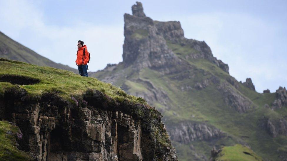 A tourist visiting the Quiraing in 2017