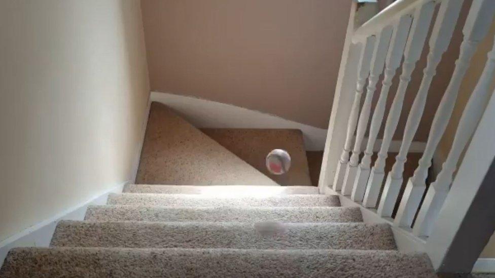 Baseball on stairs