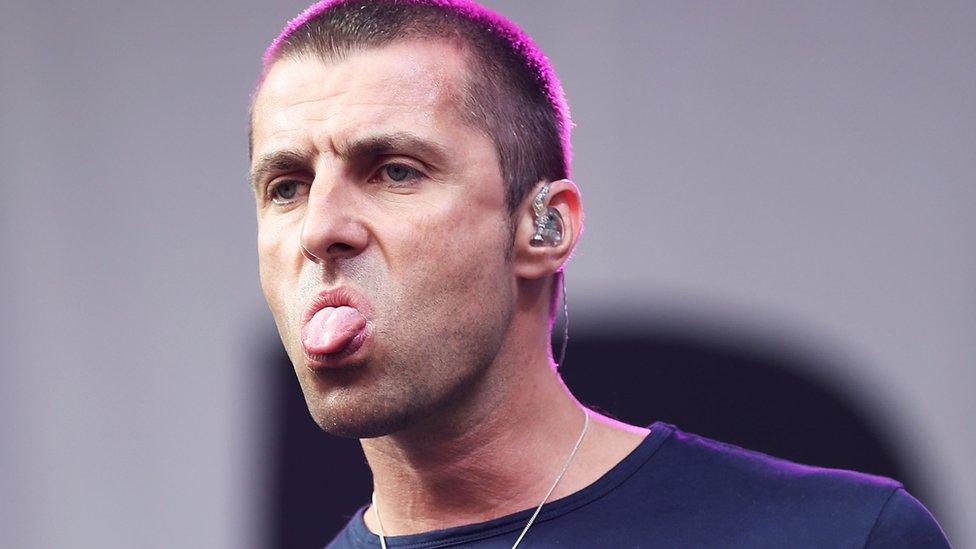 Liam Gallagher sticking his tongue out