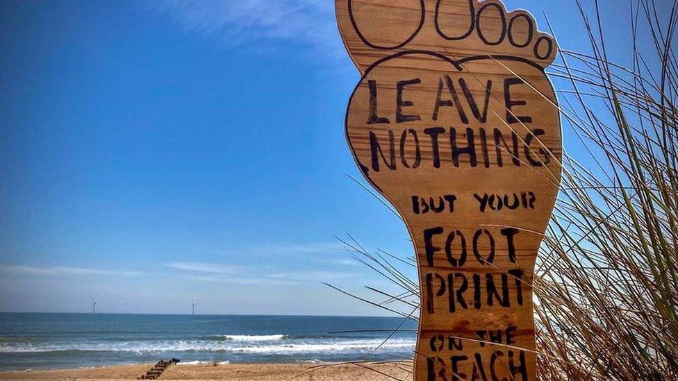 A sign on a beach at Seaton Sluice