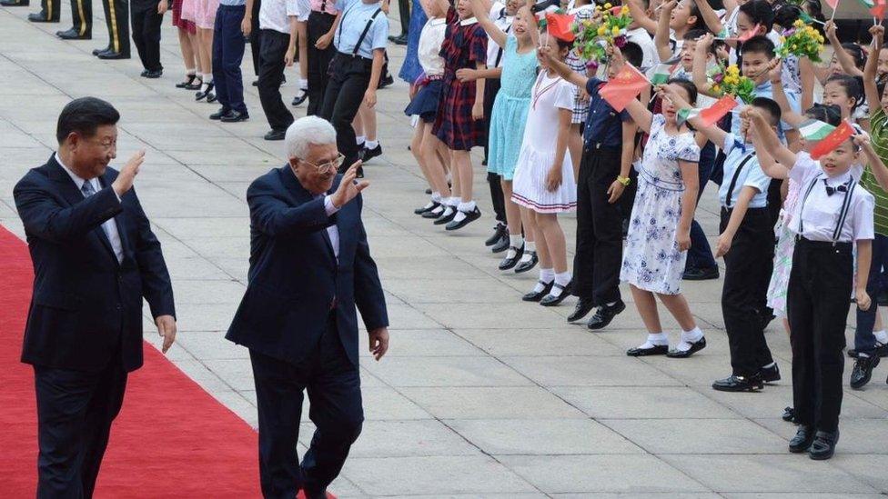 Palestinian President Mahmoud Abbas (2 L) is welcomed by President of China Xi Jinping (L) with a welcoming ceremony during his official visit in Beijing, China on July 18, 2017