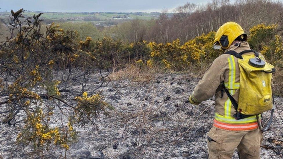 Firefighter deals with aftermath of blaze