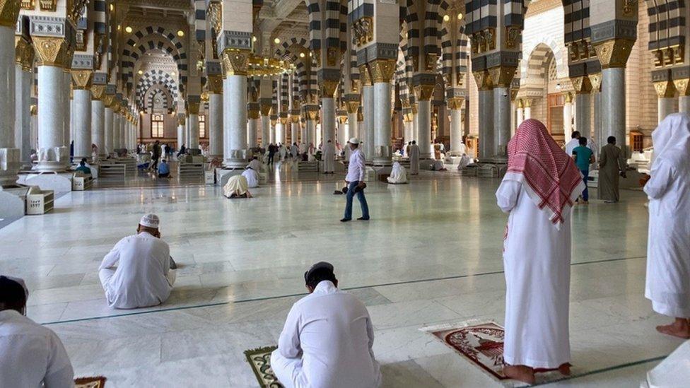 Worshippers pray in the Prophet's Mosque in Medina after it reopened for worshippers in late May