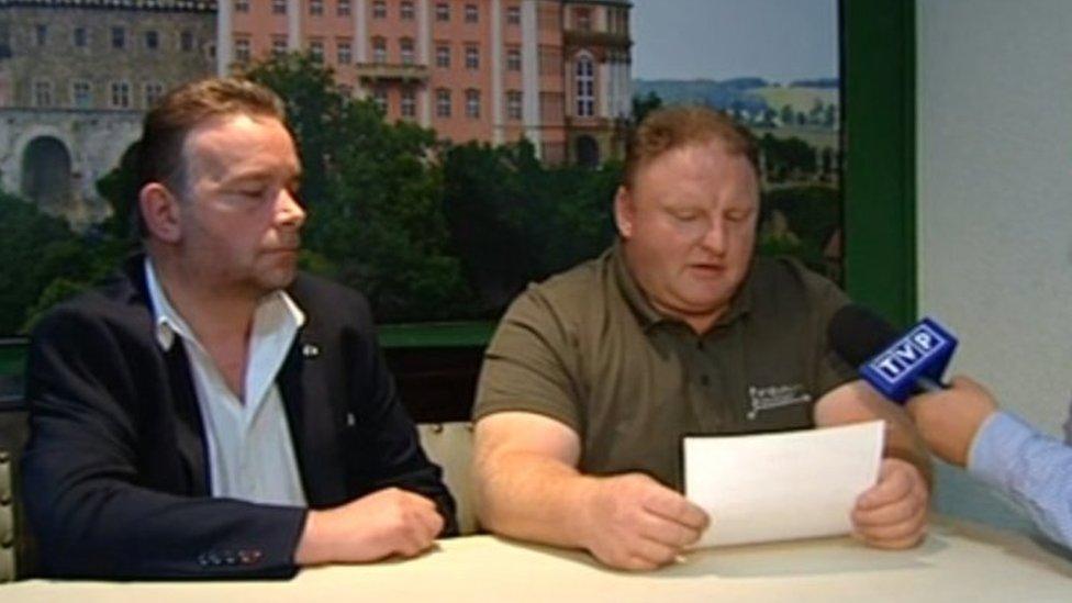 Andreas Richter, left, and Piotr Koper, centre, speak on Polish television