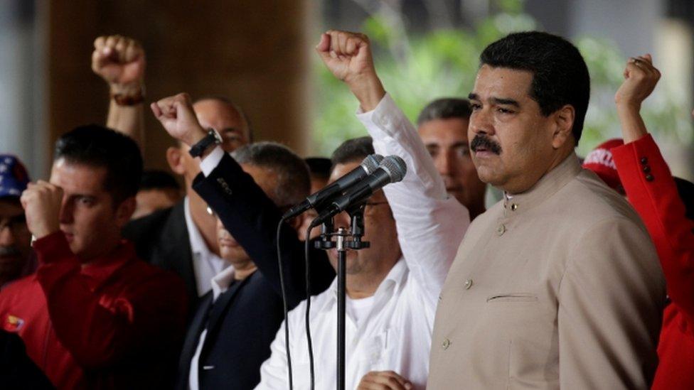 Venezuela's President Nicolas Maduro pauses while speaking during a gathering outside the National Electoral Council