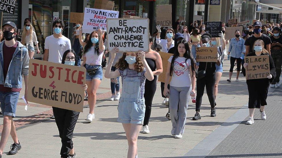 About 200 people marched along the Hertfordshire town's main shopping area.