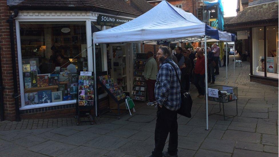 A queue builds at the Sound Knowledge shop in Wiltshire