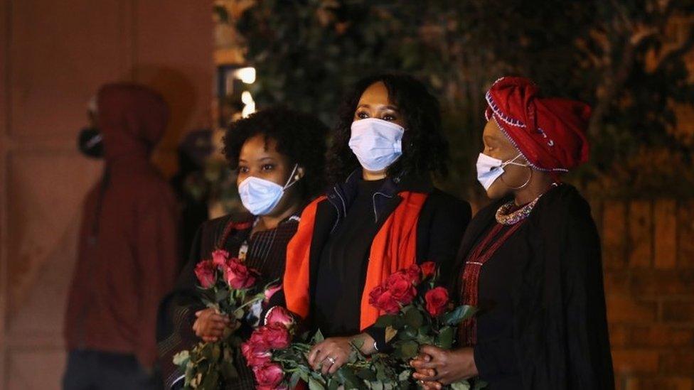 Mourners are seen as the funeral procession carrying the body of Zindzi Mandela