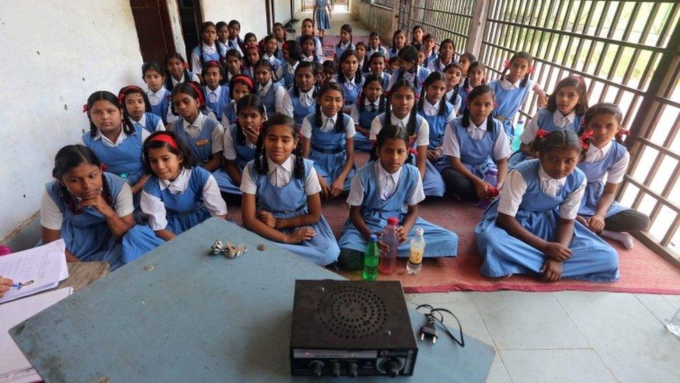 Indian pupils listen to a radio broadcast of a speech marking Teachers" Day at a school in Bhopal, India, 04 September 2015.