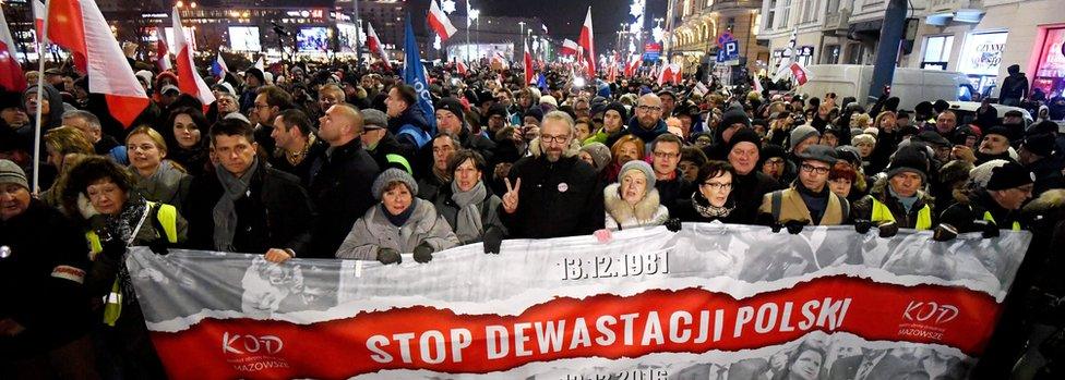 Former Polish PM Ewa Kopacz (4-R), the Committee for the Defence of Democracy (KOD) leader Mateusz Kijowski (6-R) and leader of Polish Nowoczesna Party Ryszard Petru (3-L) with other demonstrators take part in the "Stop Devastation of Poland" march