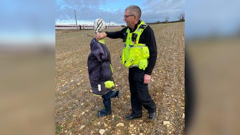 SC Phil Abbott with scarecrow