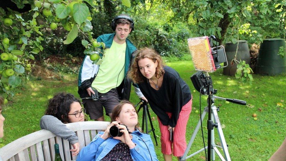 Jasmin (pictured wearing the red trousers)