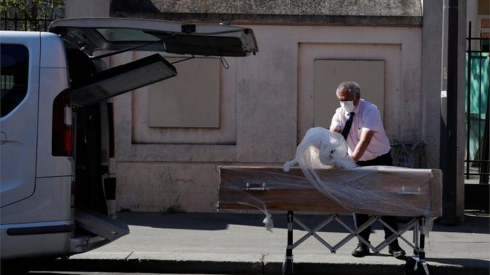 An employee delivers a coffin at the Fondation Rothschild retirement home (Ehpad) in Paris where 16 residents have died and 81 have been infected with coronavirus disease (COVID-19) as the spread of the coronavirus disease (COVID-19) continues in France, March 25, 2020