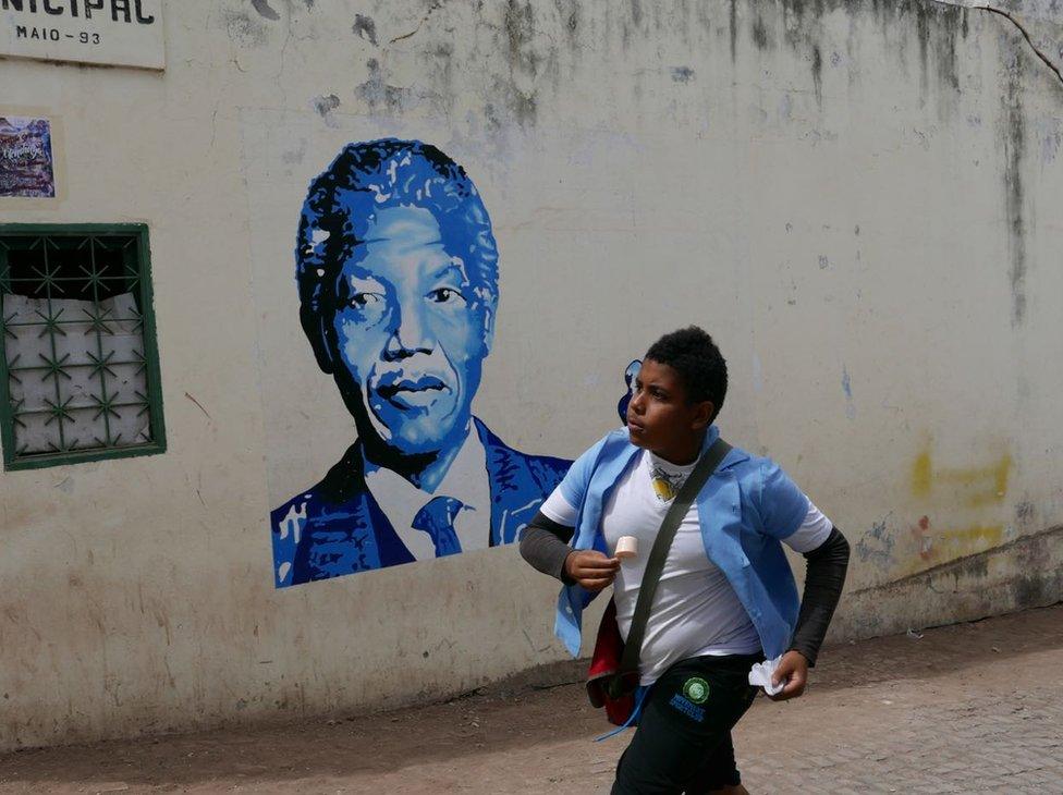 A boy running past a school in Sao Antao, Cape Verde