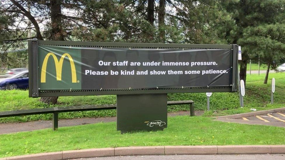 A banner asking McDonald's customers to be kind to staff