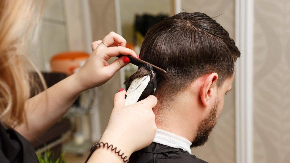 Man getting hair cut