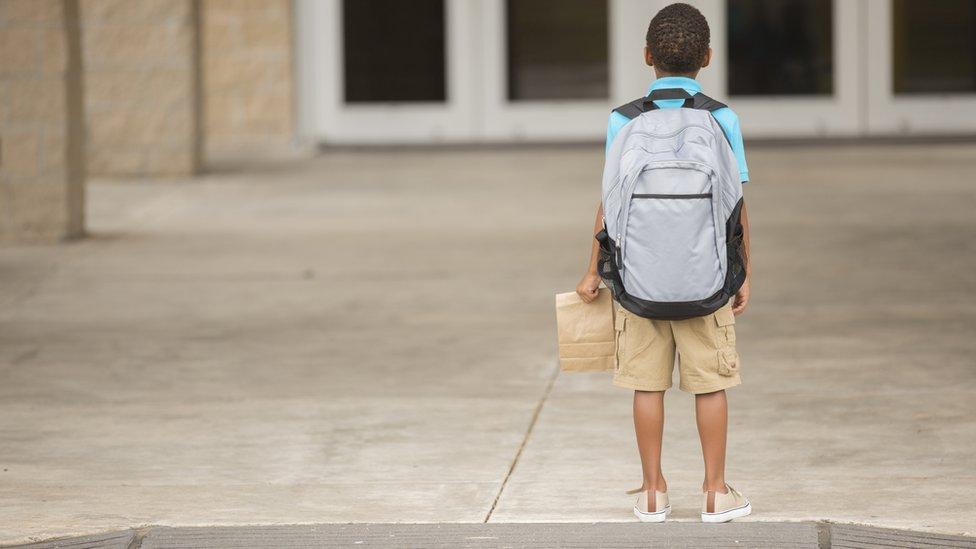 Boy outside school